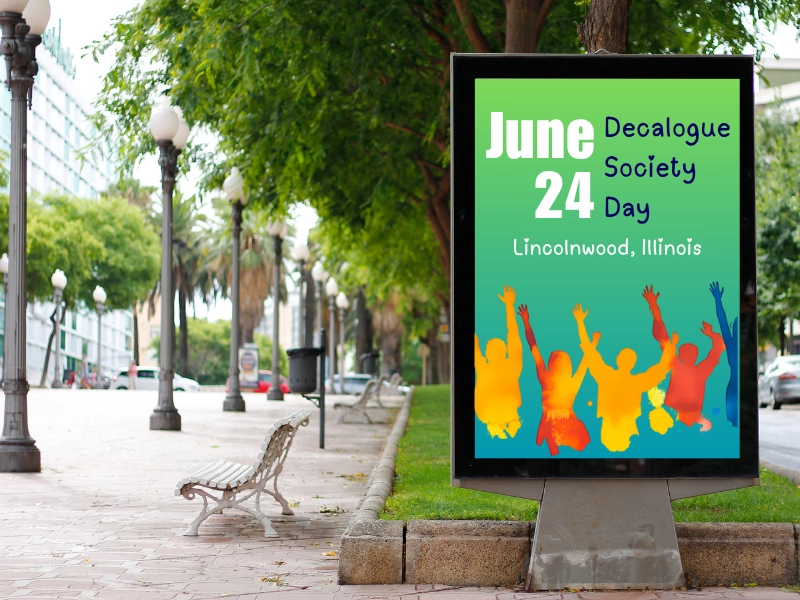 Street billboard displaying a colorful poster for Decalogue Society Day on June 24 in Lincolnwood, Illinois, featuring silhouettes of cheering people in vibrant colors.